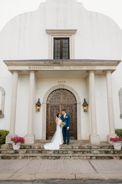 David+Addie downtown couples session in Arkansas with man and woman walking side by side down the street