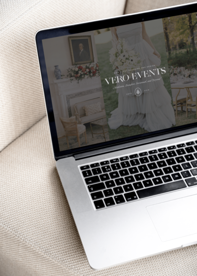 A laptop on a white pillar