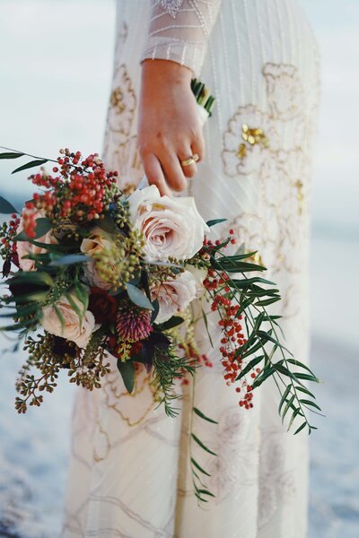 Bride Holding Flowers Wearing  Custom Engagement Ring