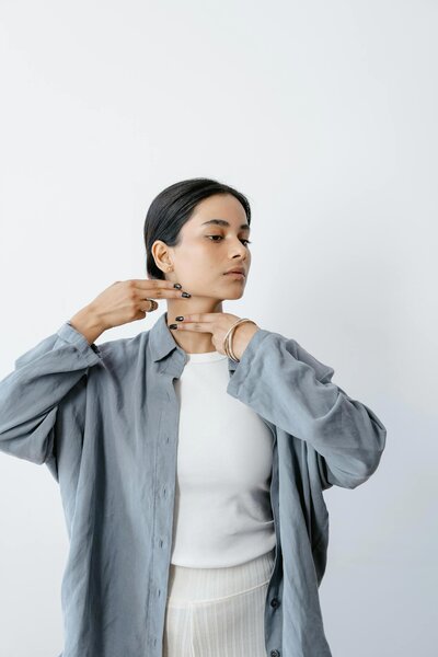 A woman doing face yoga
