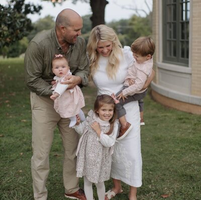 bride and groom in the mountains holding eachother