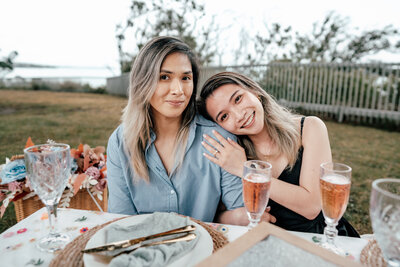 Krizzia and Mary enjoying romantic styled picnic during proposal session in Auckland, captured by Zanthe Vorsatz.
