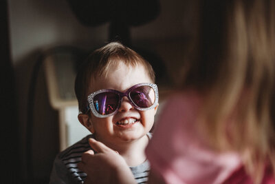 all in the frame Mom reflection in childs sunglasses