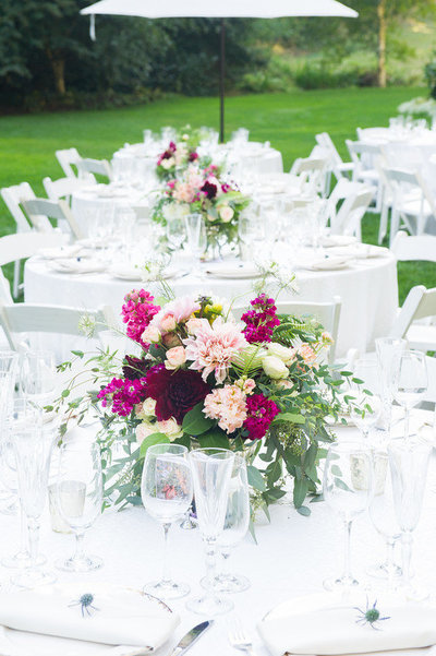 Dinner Tables at Nestldown with jewel tone florals