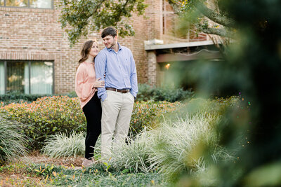 Engagement portraits of couple at The Grand Point Clear in garden