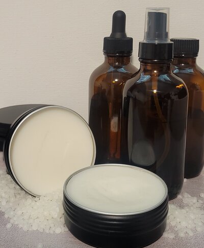 Berry & Balm rosemary body balm in tin container on countertop