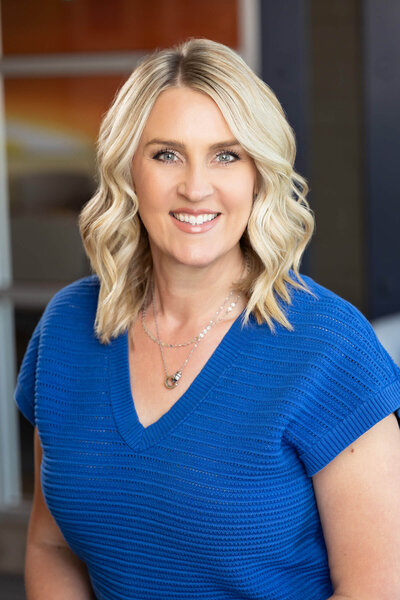 Headshot taken of business woman in Layton, Utah using her office as the backdrop.