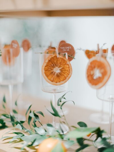 Cocktail glasses with orange slices