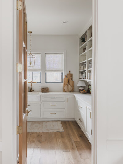 The Prep Kitchen is the heart of the home with a deep farmer's sink, small appliances and esthetic open shelving