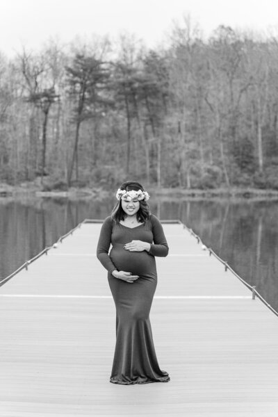 mom smiling looking at belly taken by a Woodbridge, Virginia maternity photographer