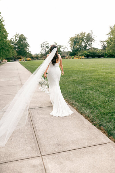 Couple laughing naturally during their wedding vows outdoors