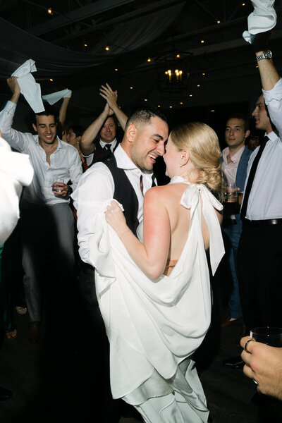 Bride and groom dancing at wedding reception