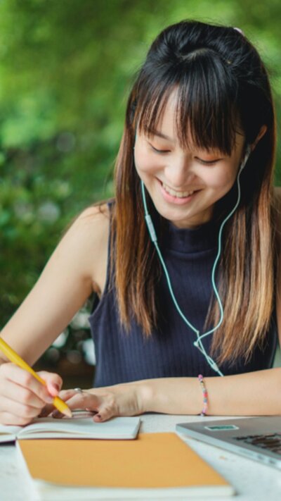 Woman standing at a crossroad representing a crossroad in her life.