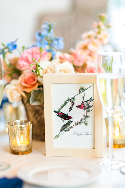 Table setting of wedding inspired by birds and spring flowers