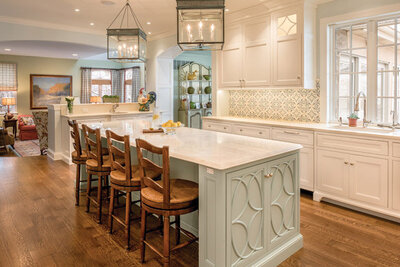 light green kitchen with wood chairs