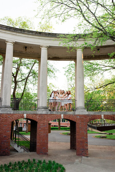 Wyatt Center columns with girls standing on second level of building outside