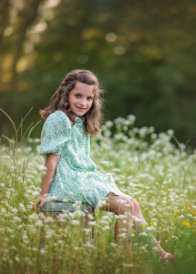 little girl in flower field