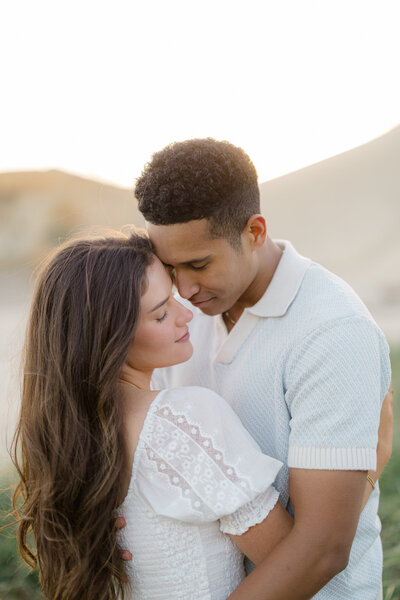 couple with water in background