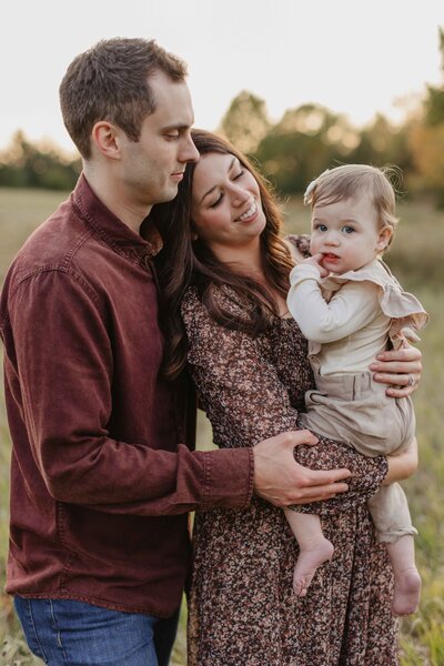 couple with baby during MN photo session