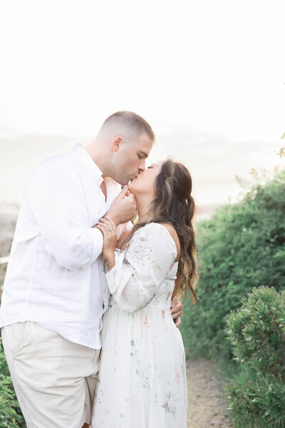 Newport Photographer Serving CT, RI, and beyond | The Corteses | Photo of a couple kiss while embracing