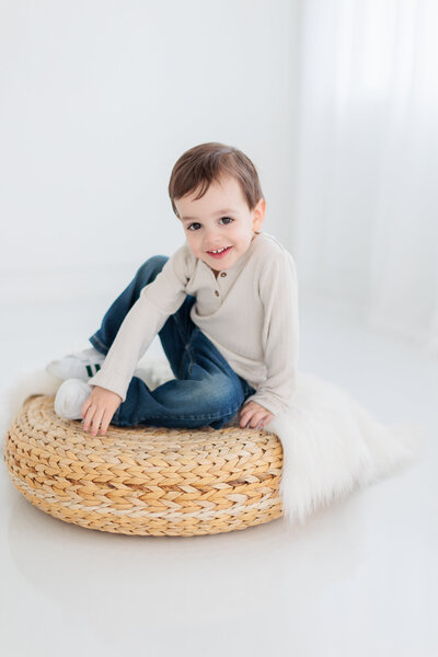 little boy sitting in boise child photography studio
