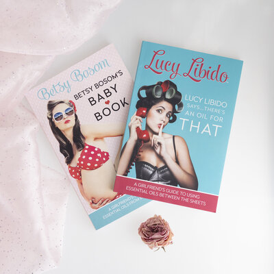 lucy libido books with pink fabric and flower around it
