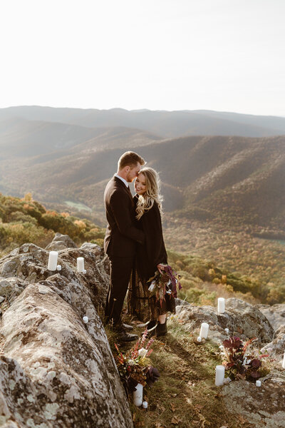 Wedding in black wedding dress embrace during their Ravens Roost in Virginia.