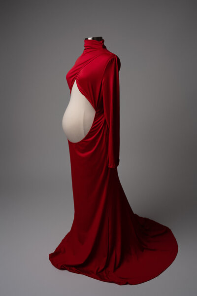 Bold red maternity gown with high neckline and belly cutout — available in Hello Photography’s client wardrobe in Austin