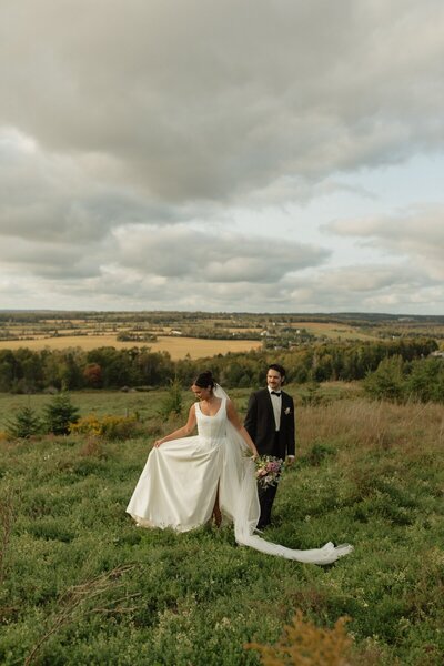 bride and groom in field at pei wedding