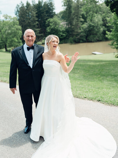 Bride laughing with her dad, taken by one of the top baltimore photographers
