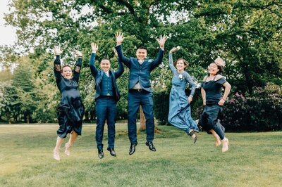 Wedding group shot with everyone jumping at the same time