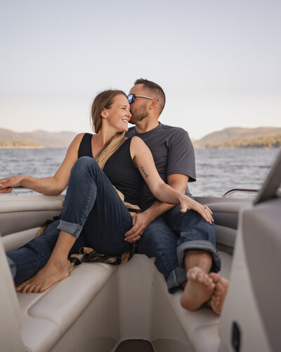 A couple relaxing on their boat on Sacandaga Lake in Upstate NY.