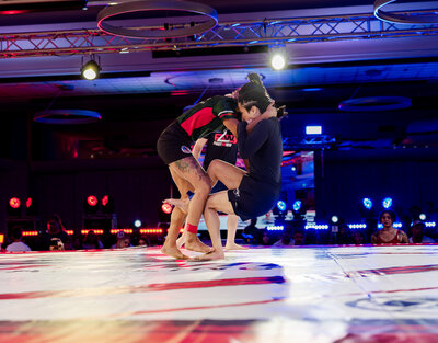 Two women grappling at F2W