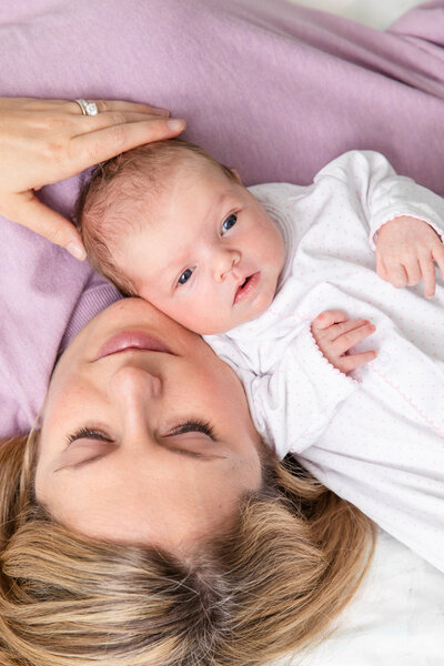 Newborn resting on mum shoulder during at home portraits by Atlanta GA newborn Photographer | Laure Photography