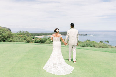 Bride and Groom face Hulopoe Bay on the island of Lanai 