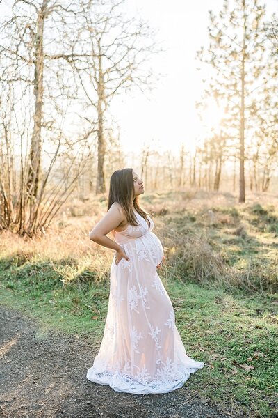 Portland mom in white dress at beach for maternity photography