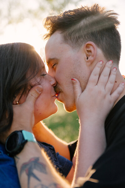 An indie LGBTQ+ couple’s moody editorial wedding portrait, photographed in a true-to-color style by Chelsea Stanford in Missouri.