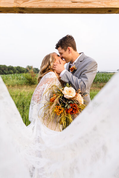 man kissing bride taken by Minnesota wedding photographer Marcus Hanenburg Photography