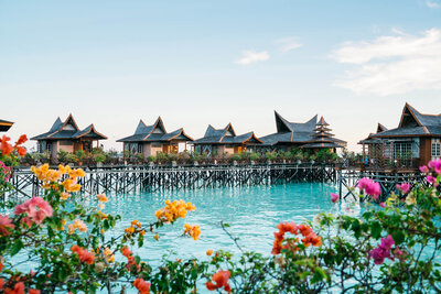 Overwater bungalows in a Thailand lagoon — perfect setting for a luxury honeymoon