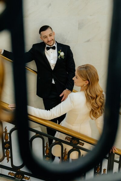 A stunning couple's portraits - bride and groom getting married at San Francisco's city hall. Luxury hair and makeup by Yana Beauty Studio.