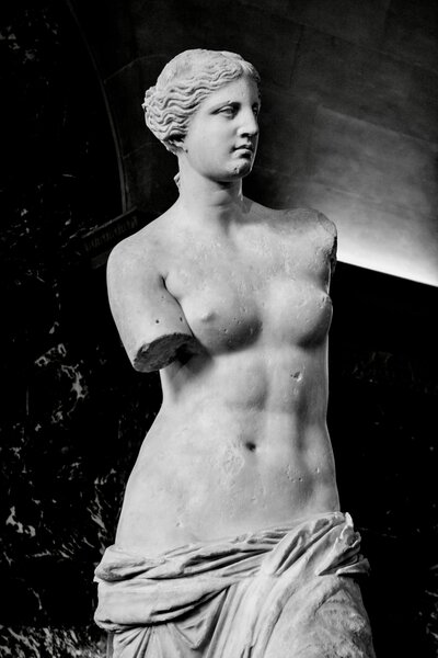 Black and white photo of classical marble sculpture of woman