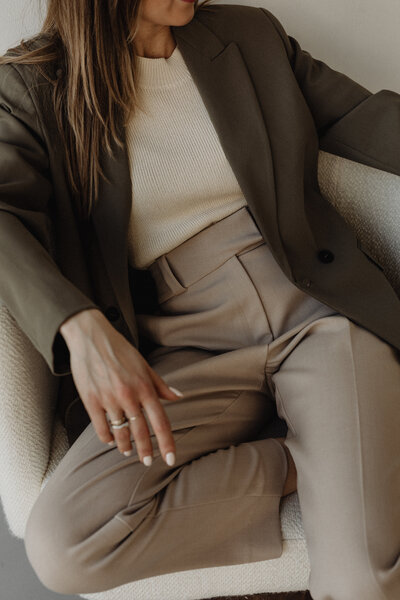 sophisticated woman sitting in chair