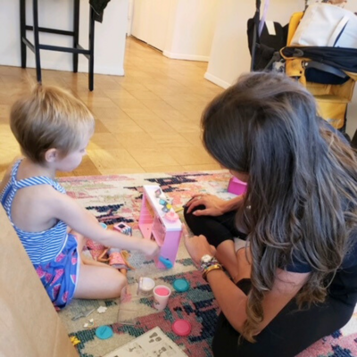 Little girl playing with crafts