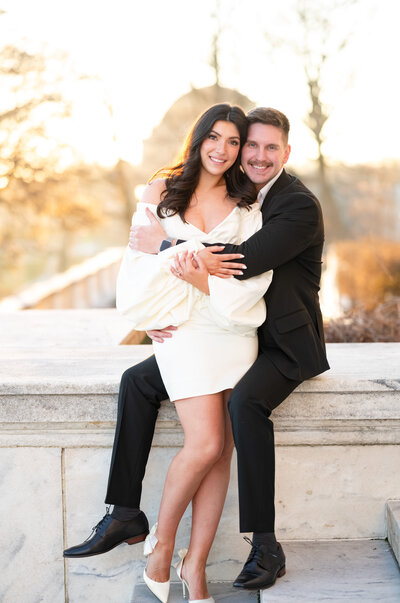 woman and man waling in park laughing