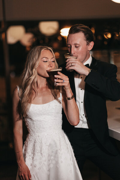 bride and groom sip espresso martinis 