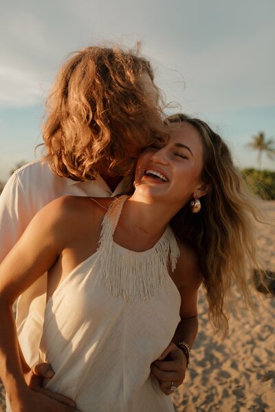 couple kissing on beach