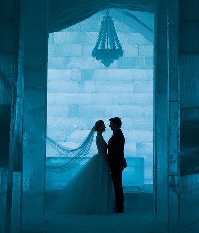 Award winning photographer Asaf Kilger photographs a bride and groom in Icehotel Sweden