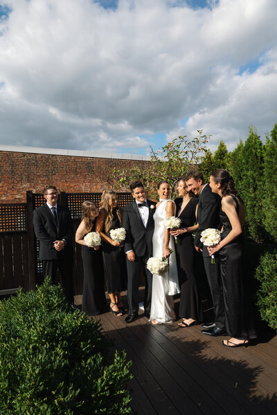 Groom swept Bride off her feet and she kisses him. Photo by Northern Virginia Photographer Alex McCormick.