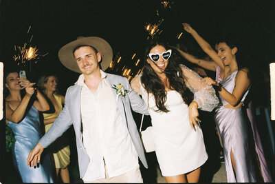 detail shot of brides sunglasses jewelry shoes and veil