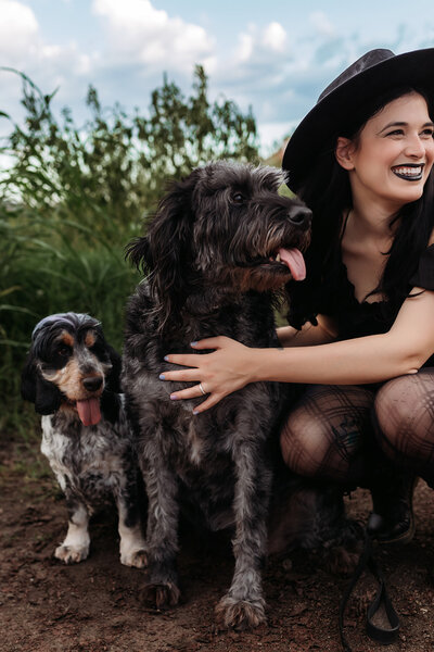 Scottsdale lifestyle portrait of woman and her dog during relaxed desert session at sunset